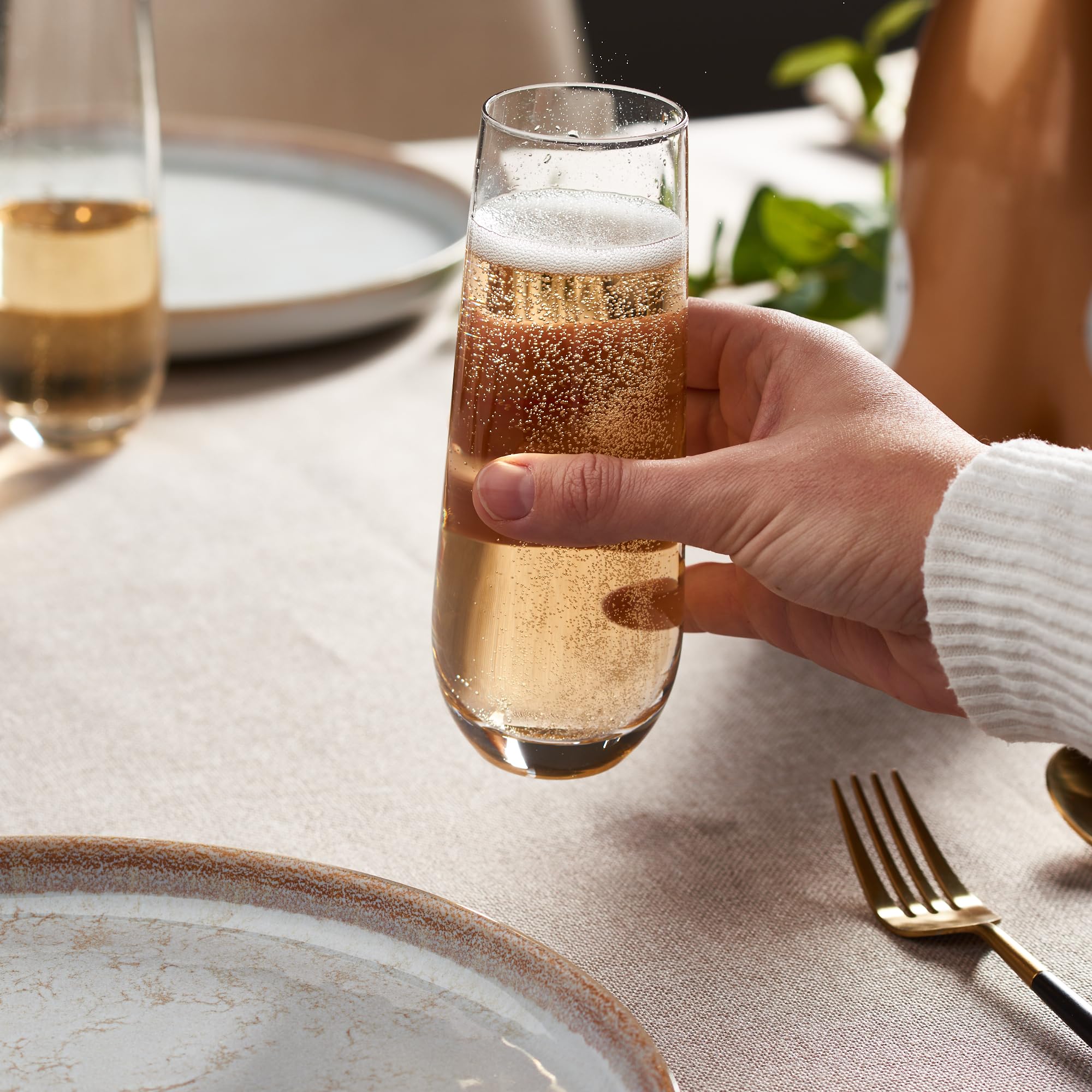 GLING held in hand for scale showing ideal 9.4 oz capacity for pours