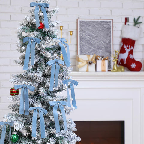Glitinsel bow placed on a Christmas tree branch, adding elegant color
