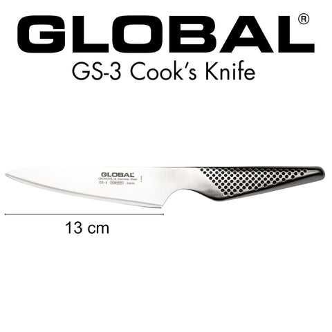 Global next to a paring knife to illustrate 5-inch size and versatility