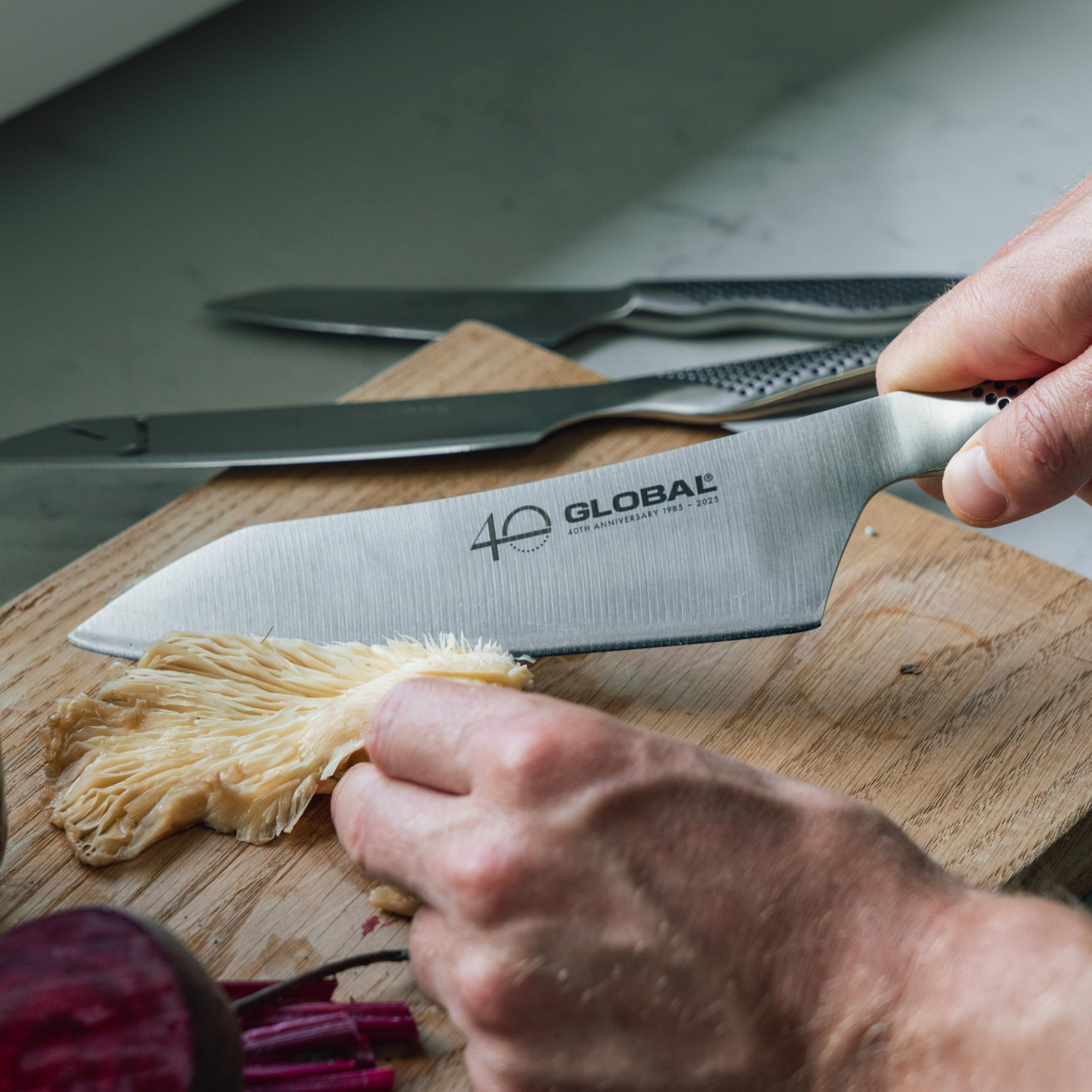 Global 6-inch Kiritsuke utility close-up showing edge and versatility