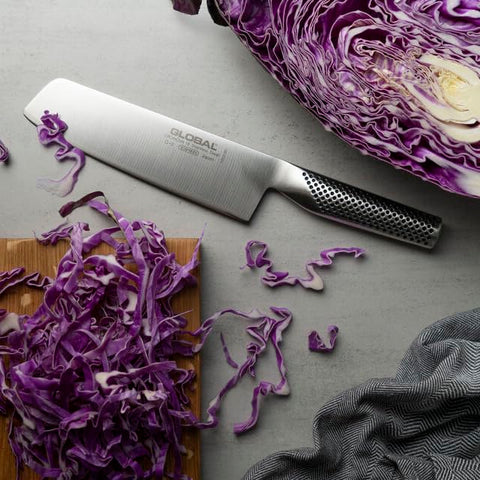 Lifestyle kitchen scene with Global nakiri on countertop for everyday culinary use
