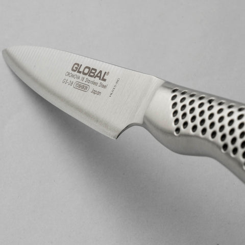 Global GS38 on cutting board showing scale for size and compactness