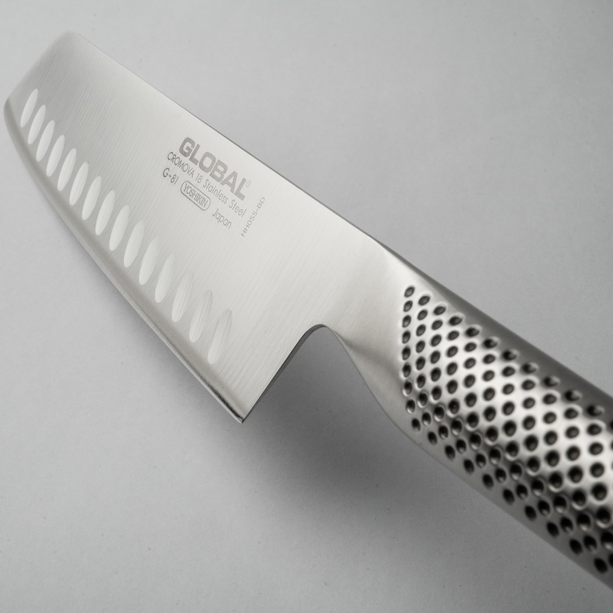 Global knife in kitchen lifestyle setting, professional-look elevates prep