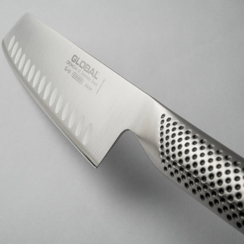 Global knife in kitchen lifestyle setting, professional-look elevates prep