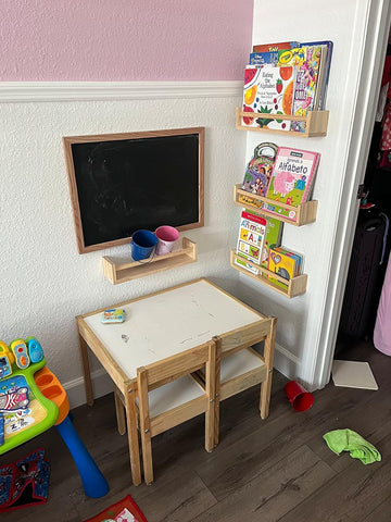 Gneric shelves in nursery with children's books for easy reach and learning