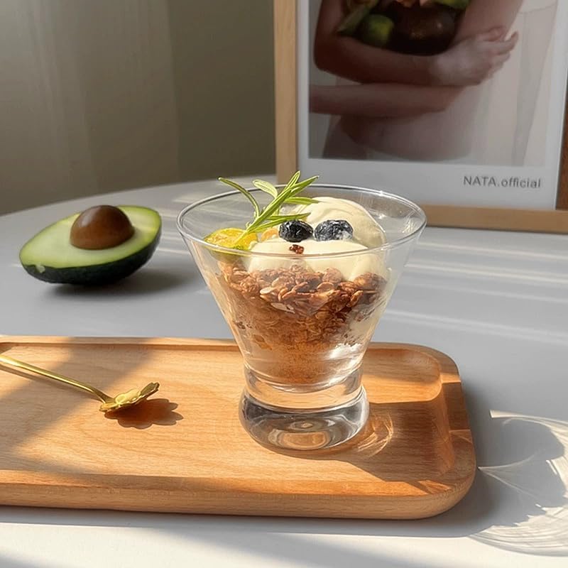 Gnimihz glass held in hand to show scale and comfortable 8oz capacity