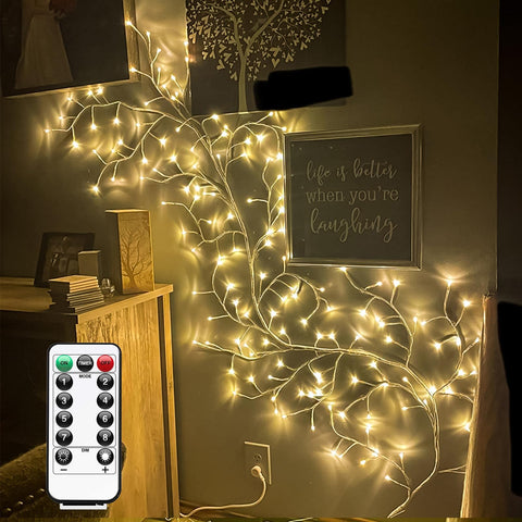 GOESWELL mantel decorated with willow vine lights for cozy focal point