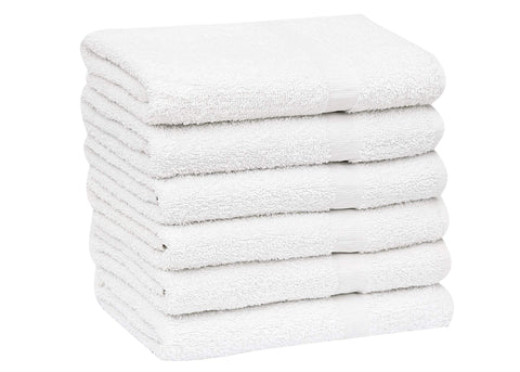 GOLD TEXTILES stack of towels ready for laundry, emphasizes easy care