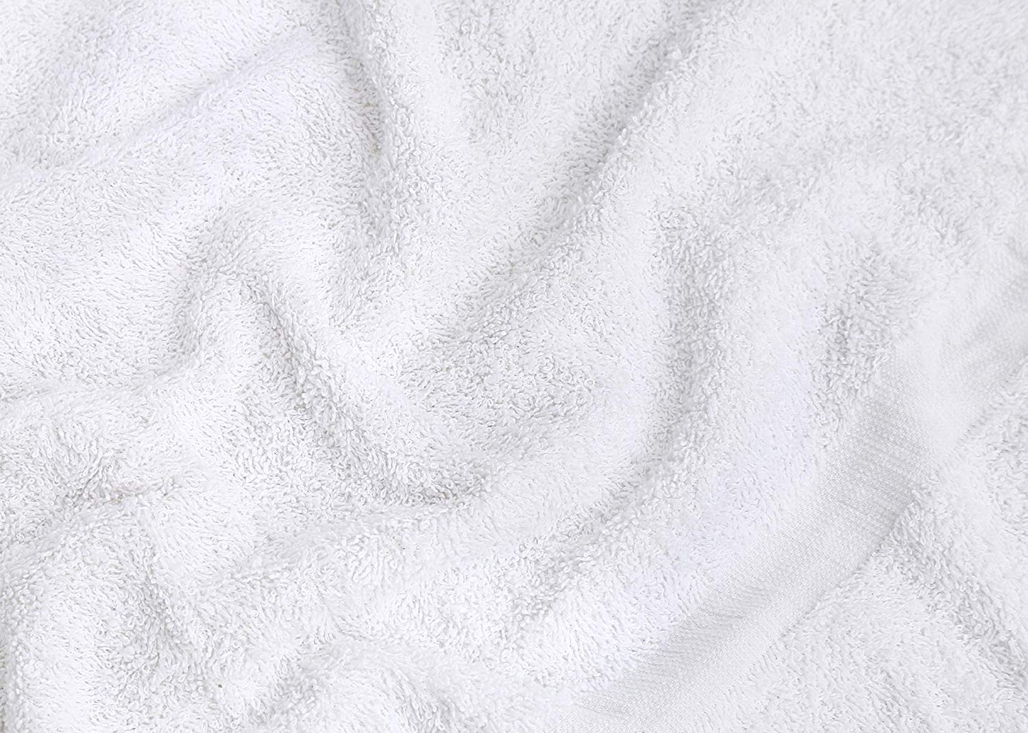 GOLD TEXTILES towels styled in a spa bathroom presenting tidy guest-ready look