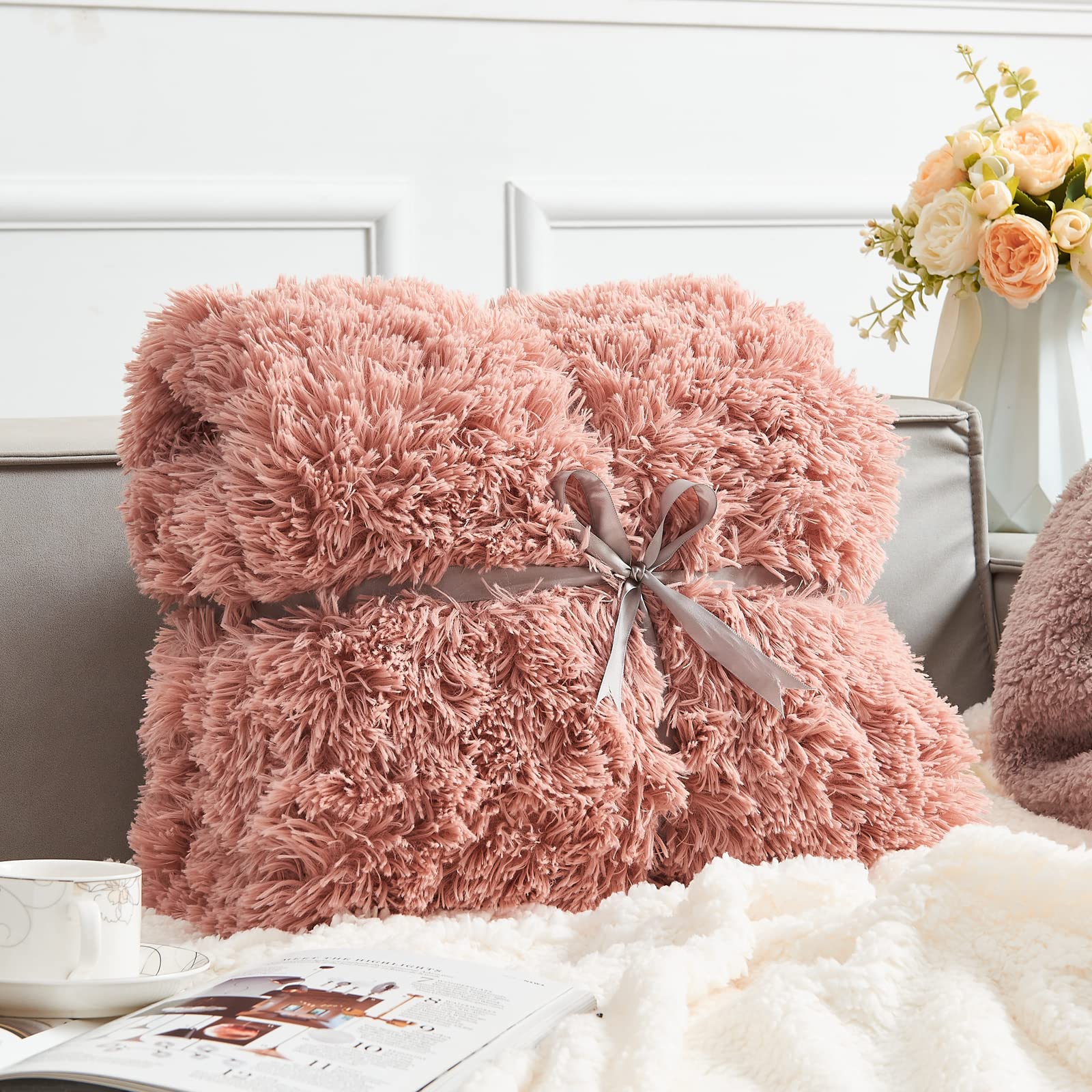 GONAAP throw styled on bed creating warm, inviting bedroom decor