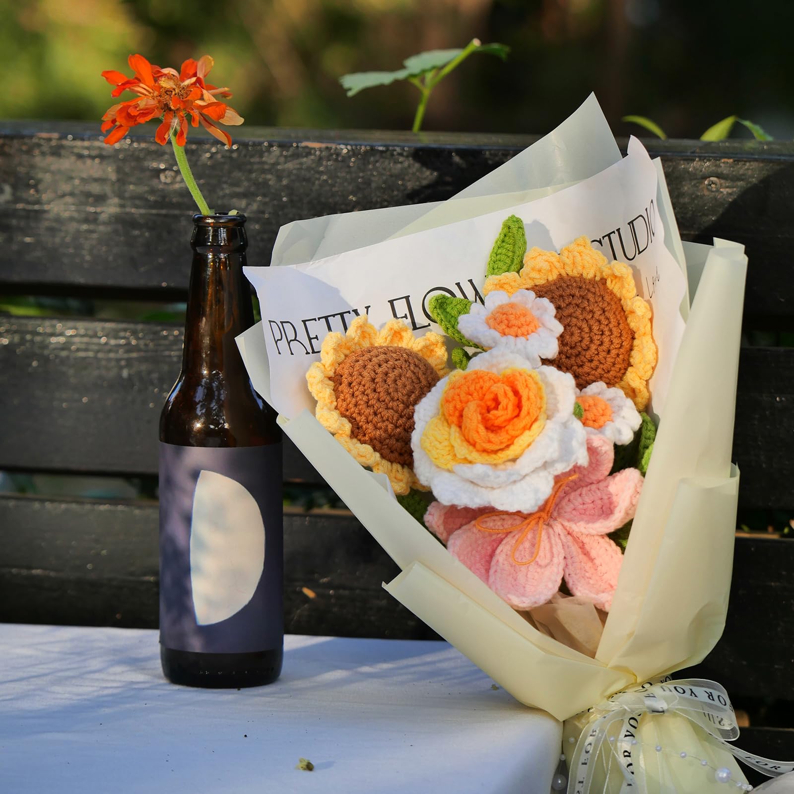 Gouraml arrangement of daisies and seven leaves, offering long-lasting decorative color