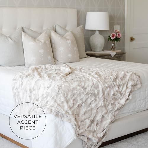 GRACED SOFT LUXURIES lifestyle scene with reader using throw showing cozy relaxation