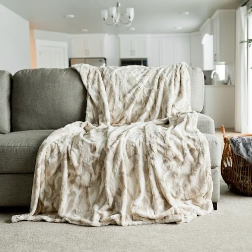 GRACED SOFT LUXURIES throw compared on chair showing 50x60 size and coverage benefit