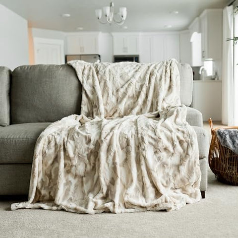 GRACED SOFT LUXURIES throw compared on chair showing 50x60 size and coverage benefit