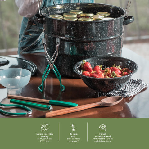 Granite Ware in a kitchen scene with jars being lowered to illustrate easy at-home canning