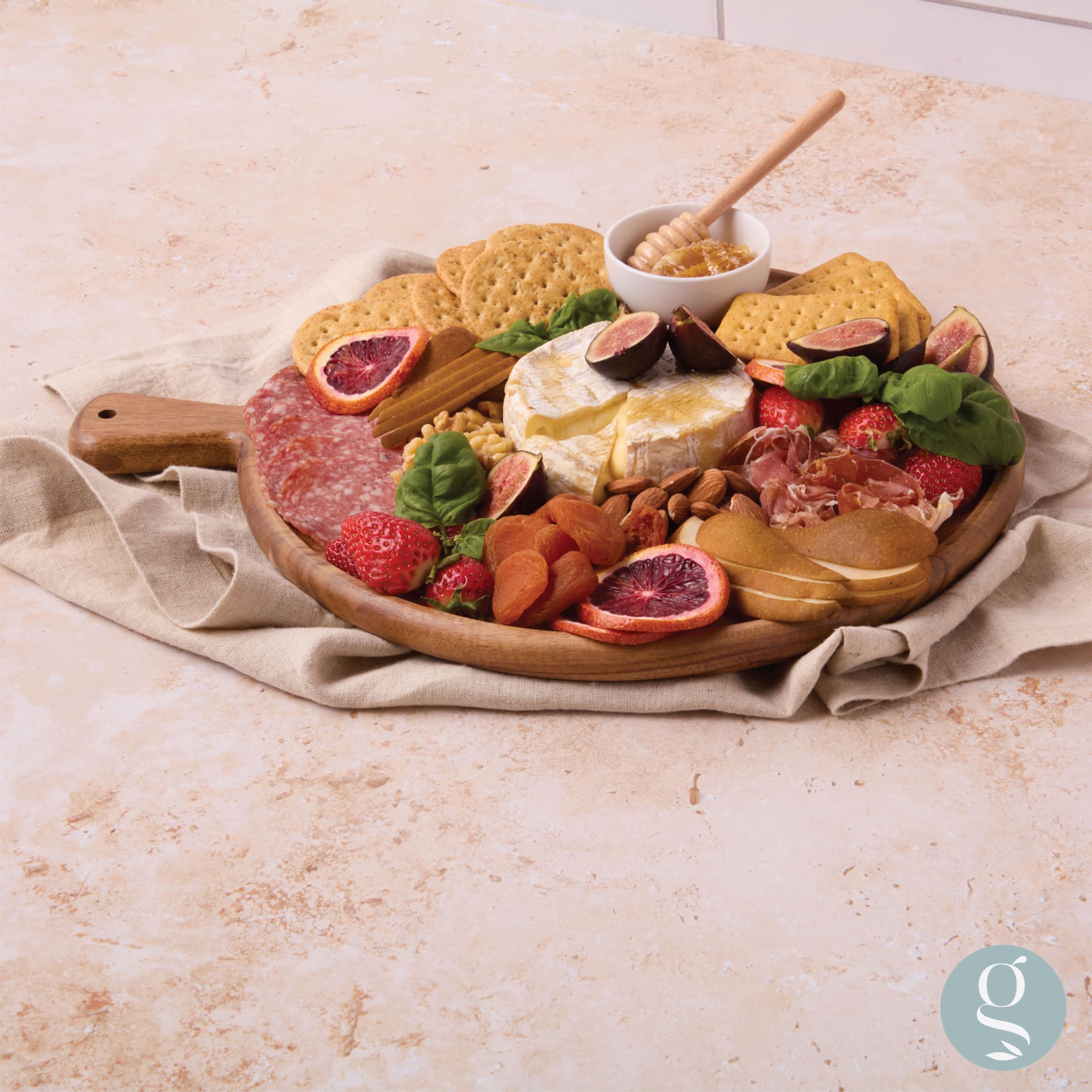 Grazerie board next to wine glass indicating scale and tabletop-friendly size