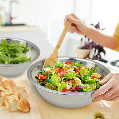 Great Credentials in-use shot mixing a large salad demonstrating capacity and convenience