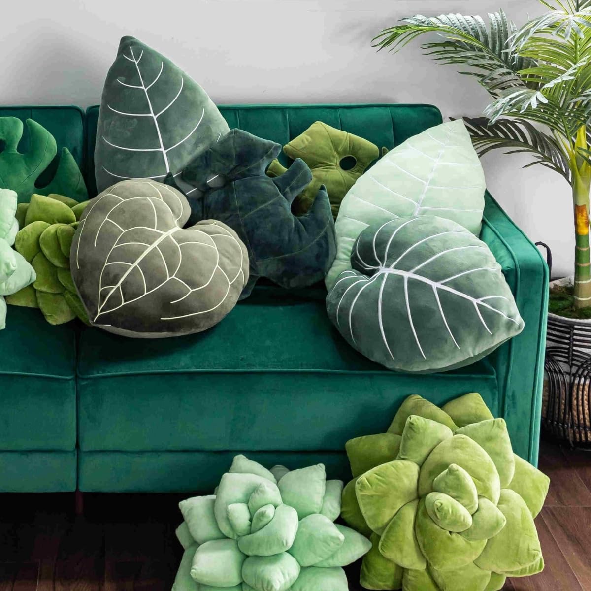 Green Philosophy Co. Leaf™ styled on a sofa adding botanical accent and depth