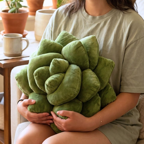 Green Philosophy Co. pillow styled on sofa brings botanical accent to living room