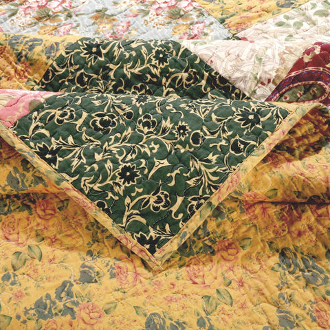 Greenland Home Fashions throw at bed footboard, creates cozy vintage-inspired bedroom styling