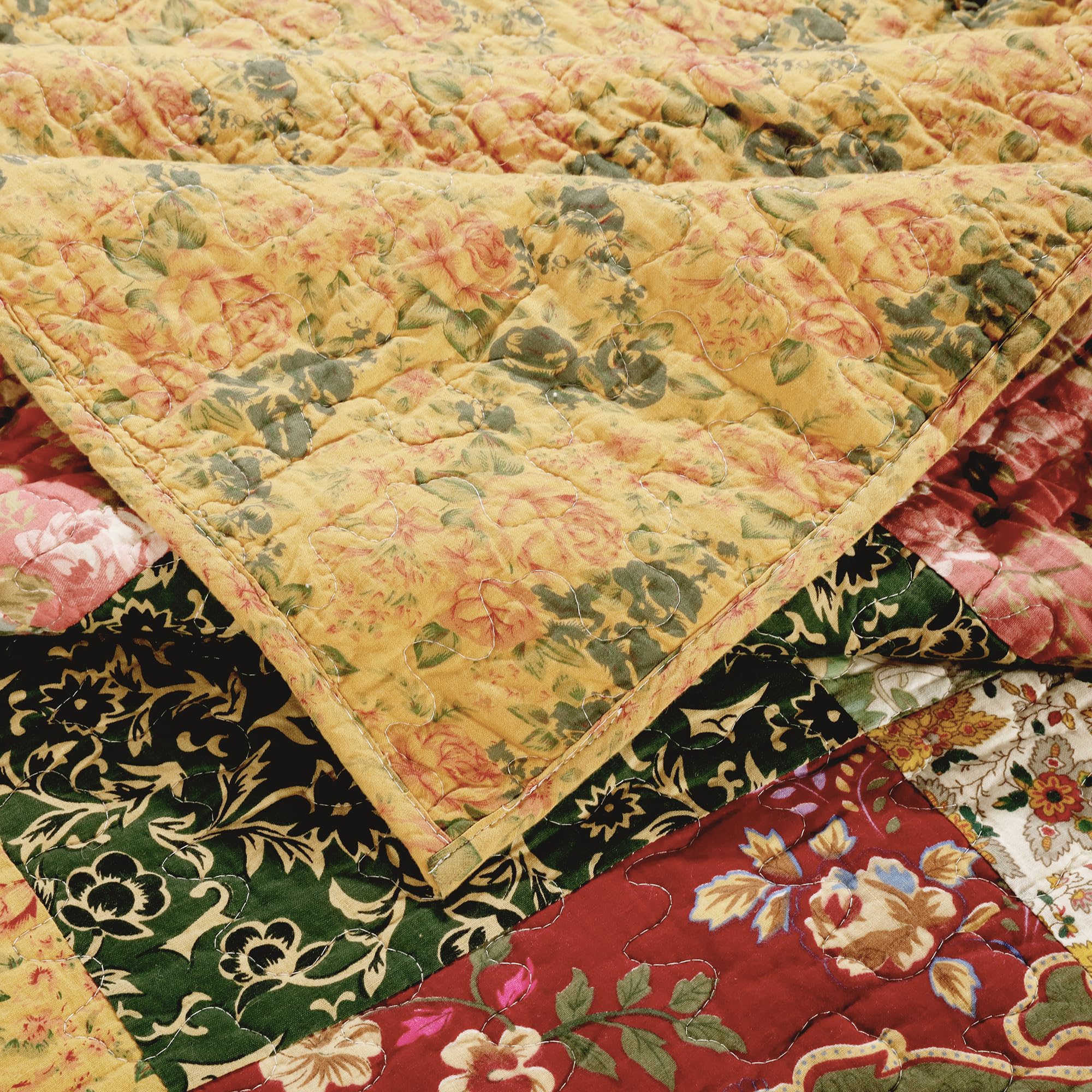 Greenland Home Fashions throw draped on sofa, adds colorful layered accent to living room