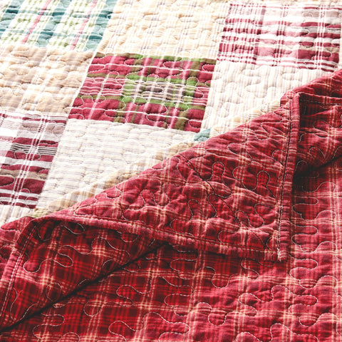 Greenland Home Fashions throw draped on sofa demonstrating cozy layering and decor enhancement