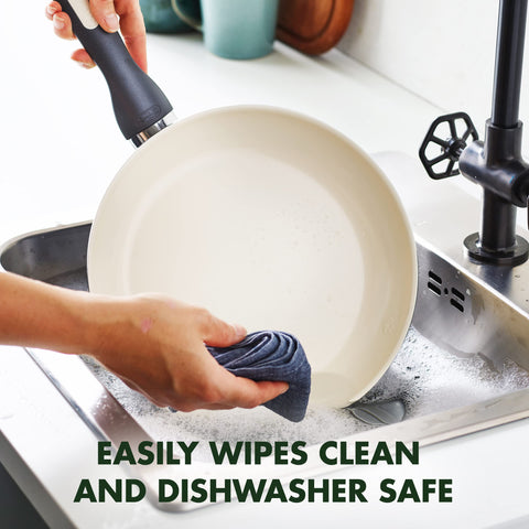 GreenPan Rio pan being wiped clean to show easy dishwasher and hand-clean benefit
