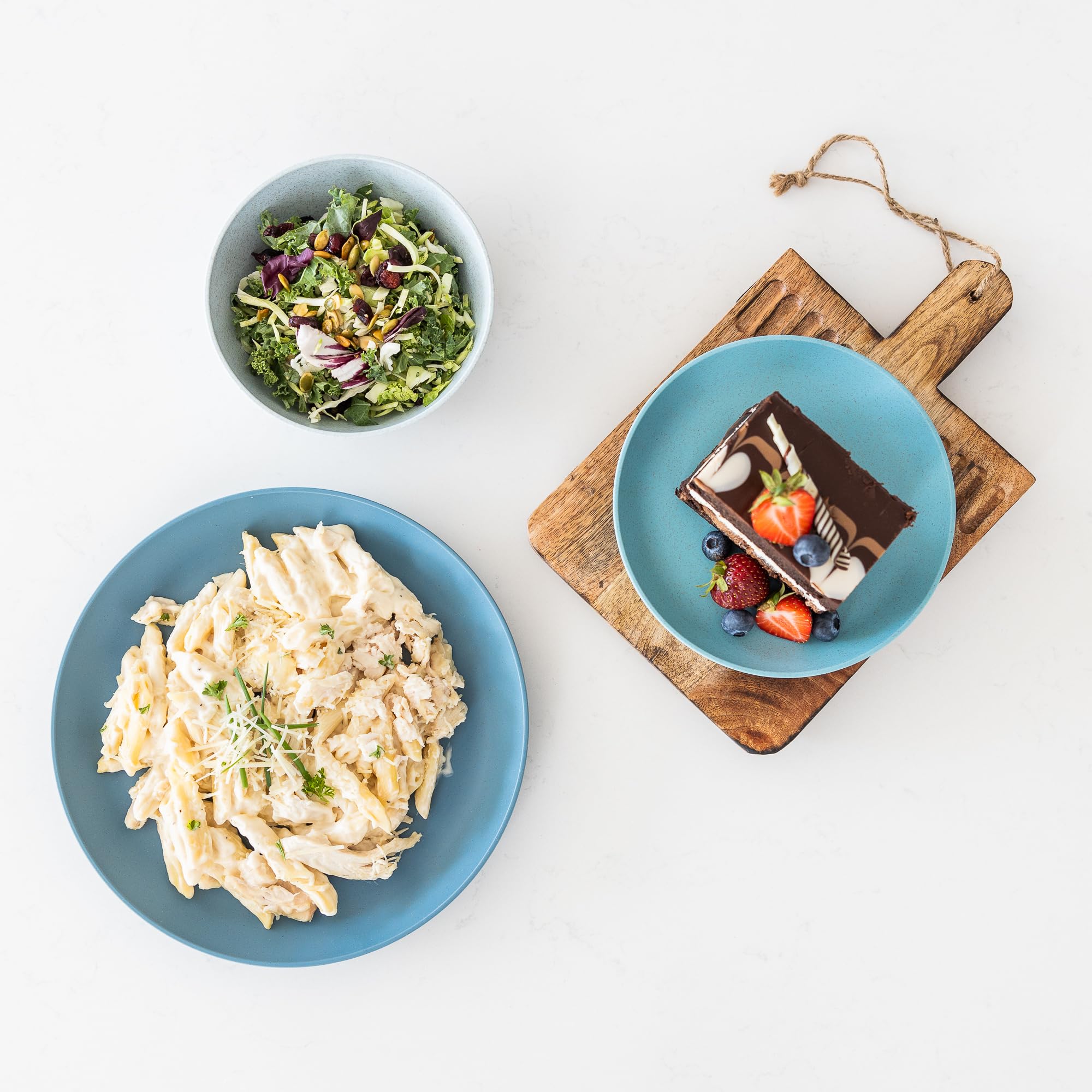 Grow Forward plate held in hand showing lightweight, travel-friendly scale