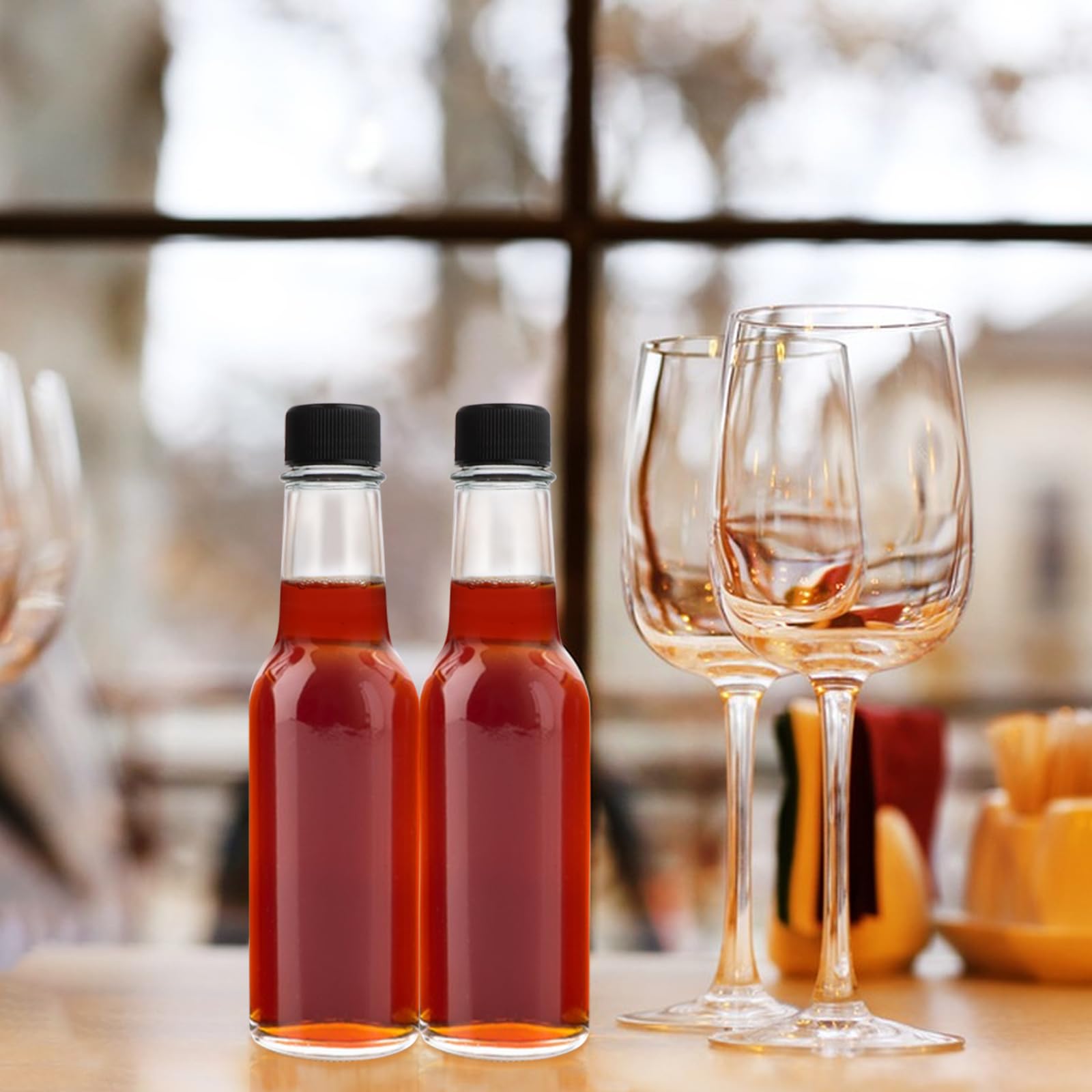 GUANENA bottles styled on a table with sauces and tags for gift presentation and retail appeal