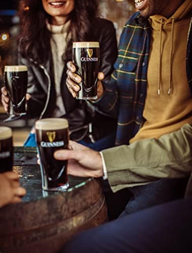 Guinness glass in hand lifestyle shot illustrates balance and grip
