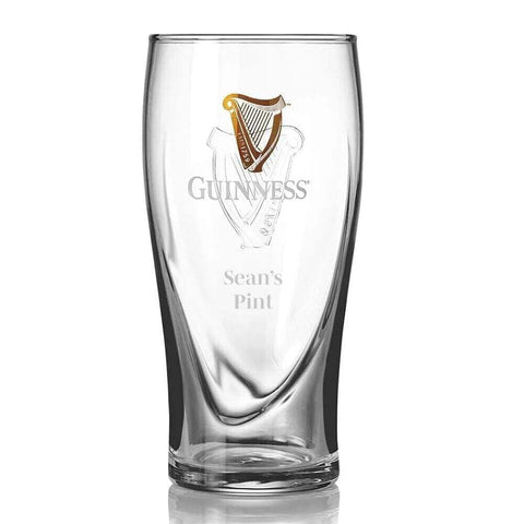 Guinness glass in use during pour showcasing head retention and presentation