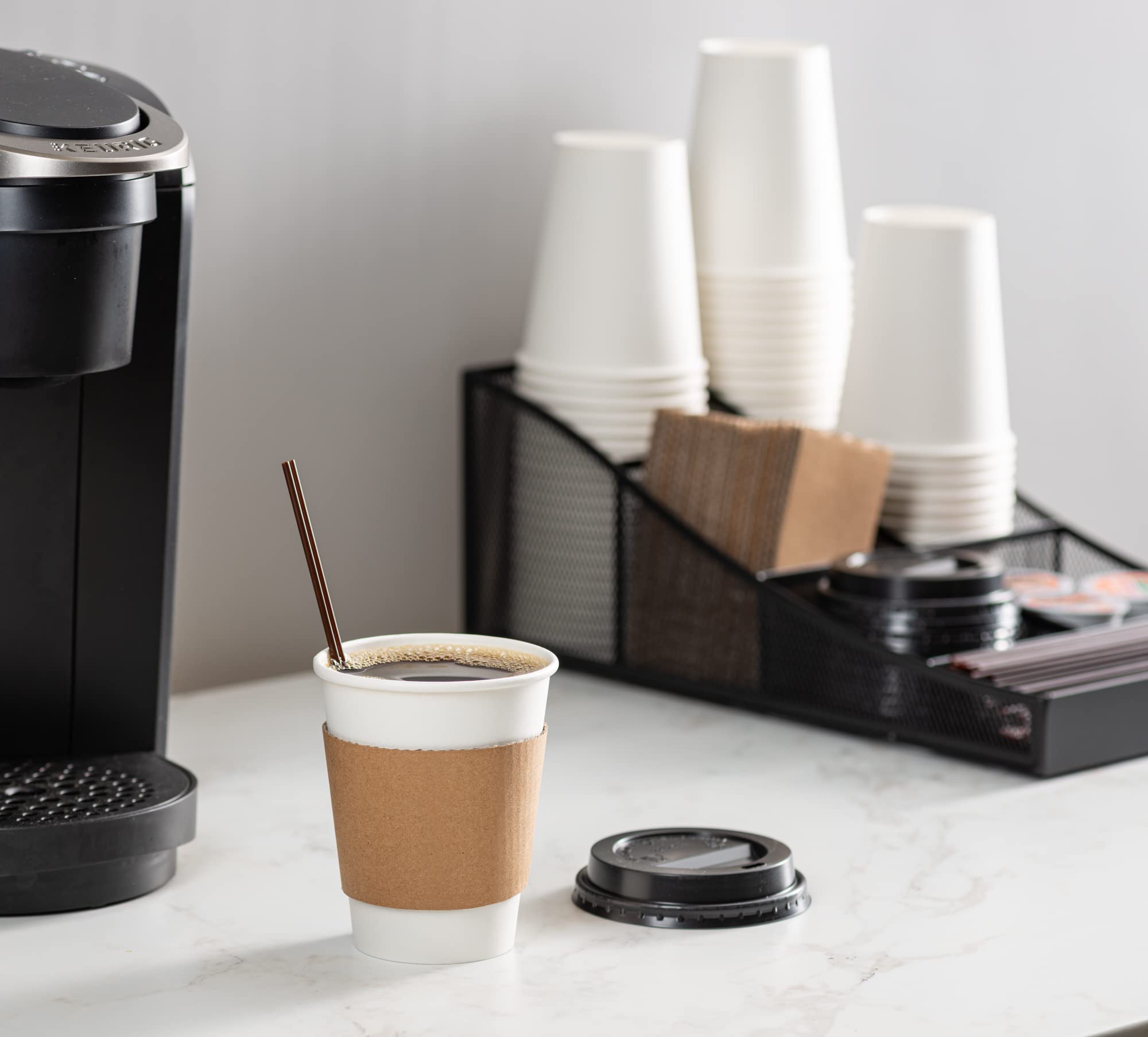 GUSTO cup in hand during travel showcasing leak-resistant lid advantage
