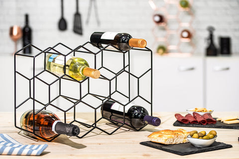 gusto nostro next to a bottle showing true size and practical scale