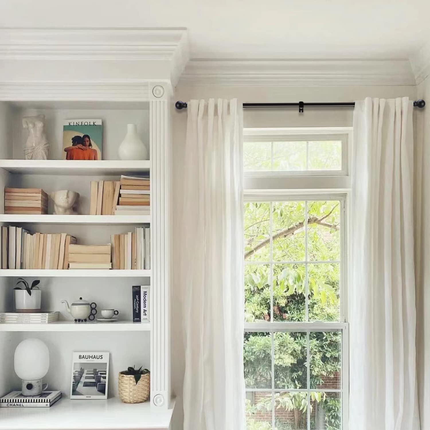 GXOACKJ installed above living room window showing aesthetic fit and support