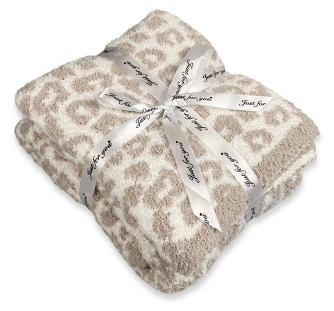 GY leopard throw front on sofa showing stylish decor and cozy warmth