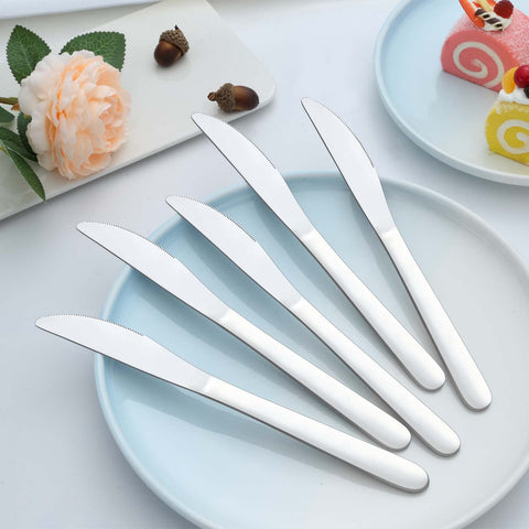 Gymdin knives alongside a ruler showing 9-inch scale and reliable sizing