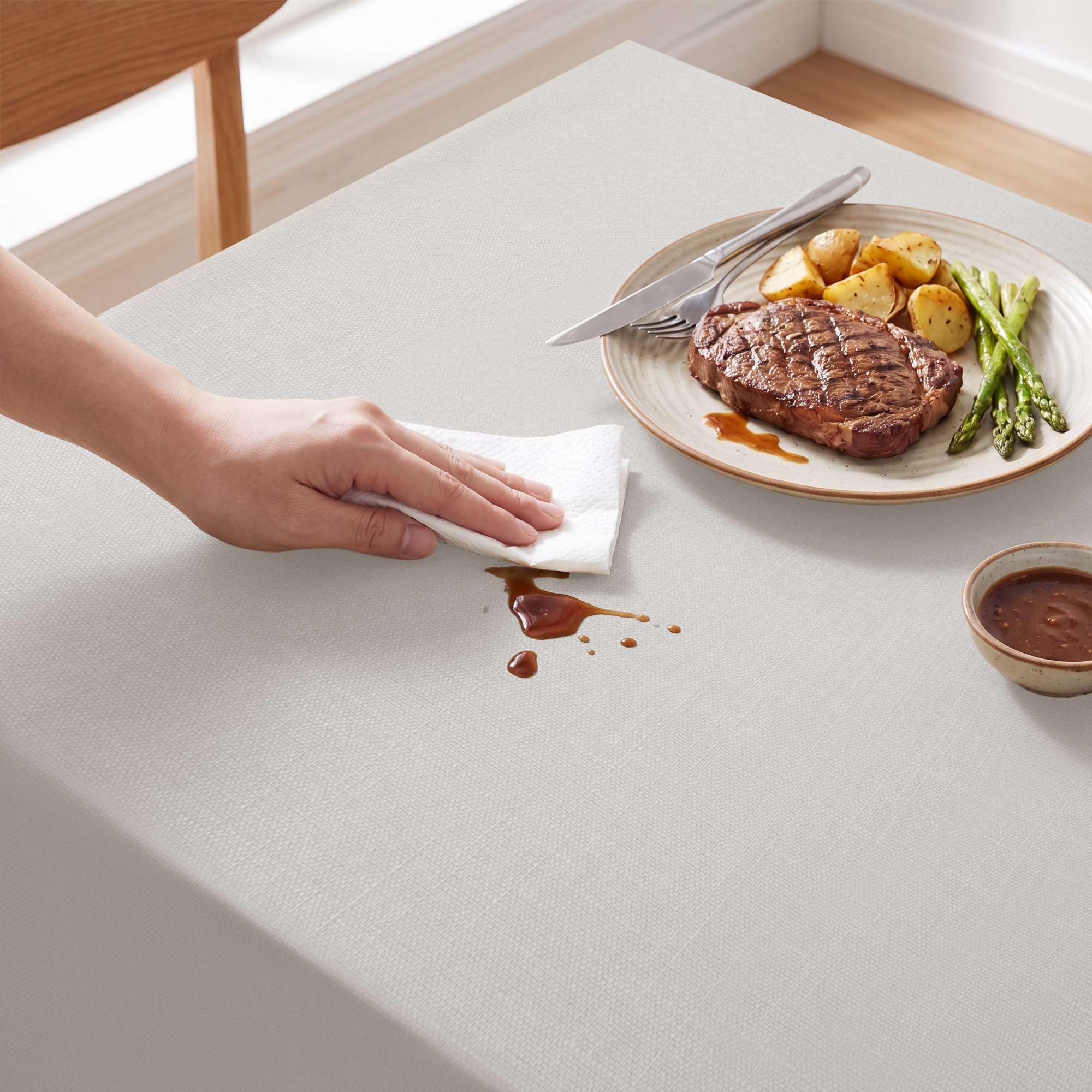 H.VERSAILTEX spill wipe demonstration showing waterproof surface that eases cleanups