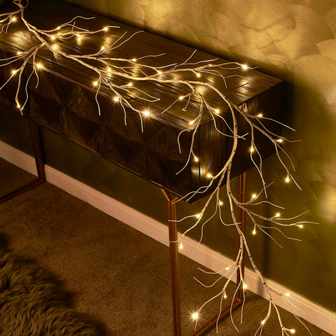 Hairui garland draped on mantel creating cozy fireplace holiday styling