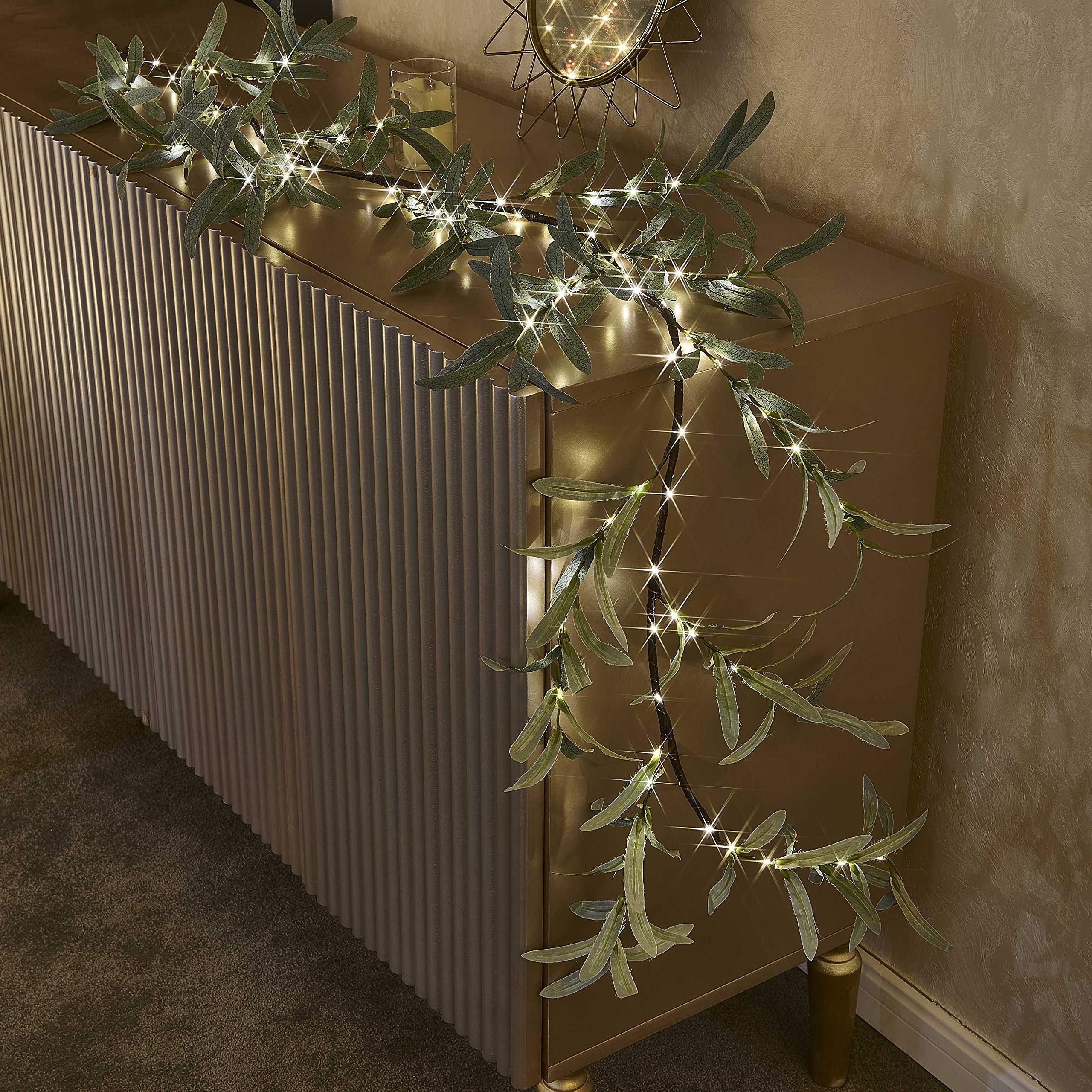 Hairui garland wrapped around stair rail for instant entryway charm
