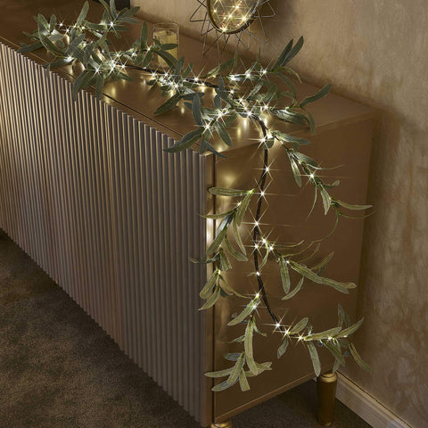 Hairui garland wrapped around stair rail for instant entryway charm