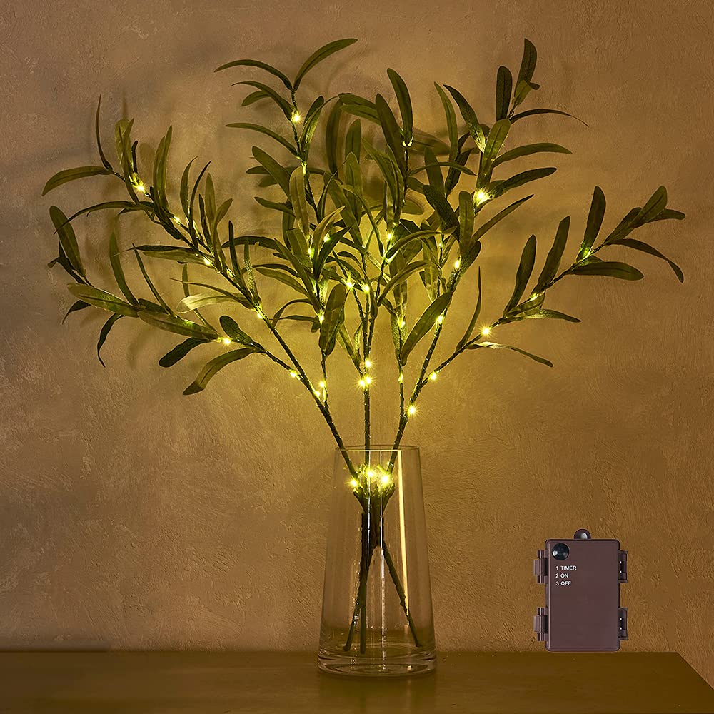 Hairui lighted olive branches glowing in a vase creating warm ambient atmosphere
