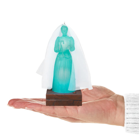 Hallmark Keepsake Constance Hatchaway showing button and hanger for easy activation and mounting