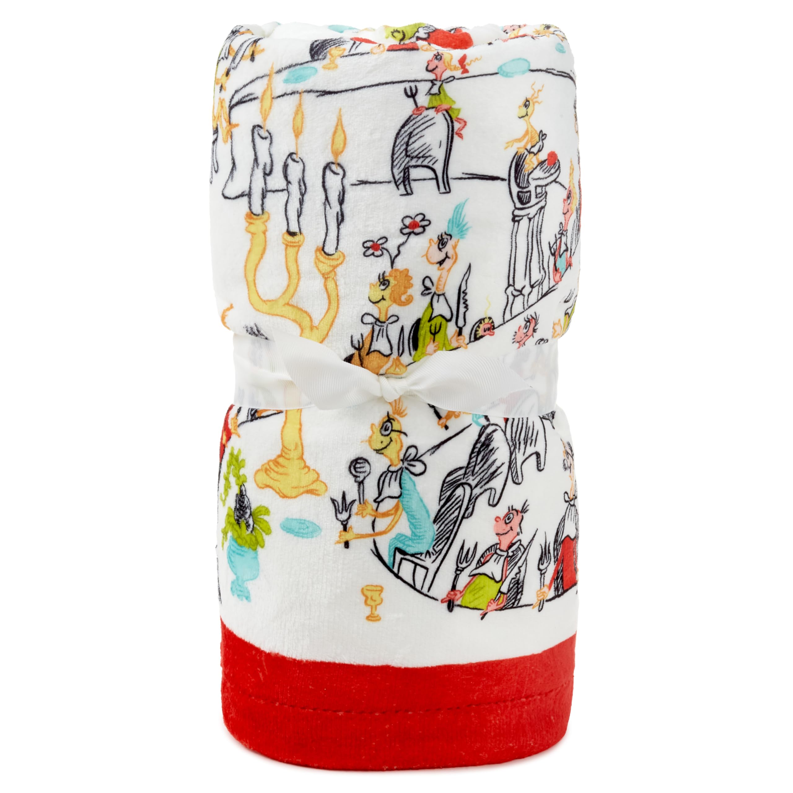 Hallmark Grinch throw draped on sofa illustrating cozy holiday atmosphere
