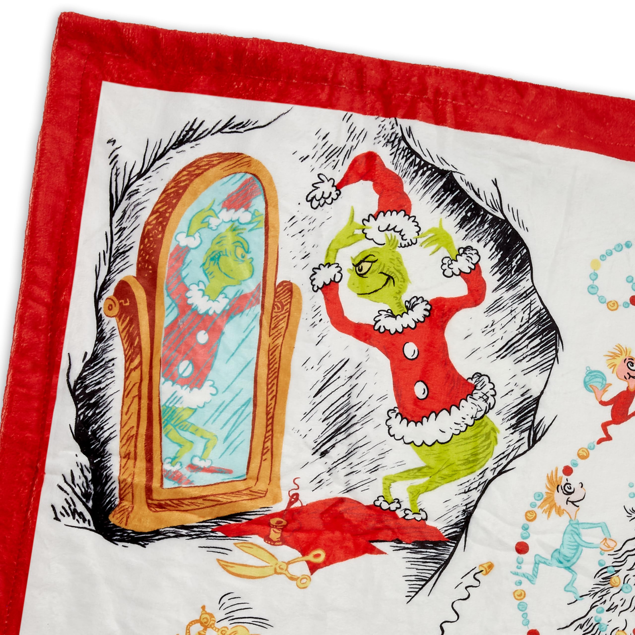 Hallmark Grinch throw on lap showing 50x60 size for personal warmth