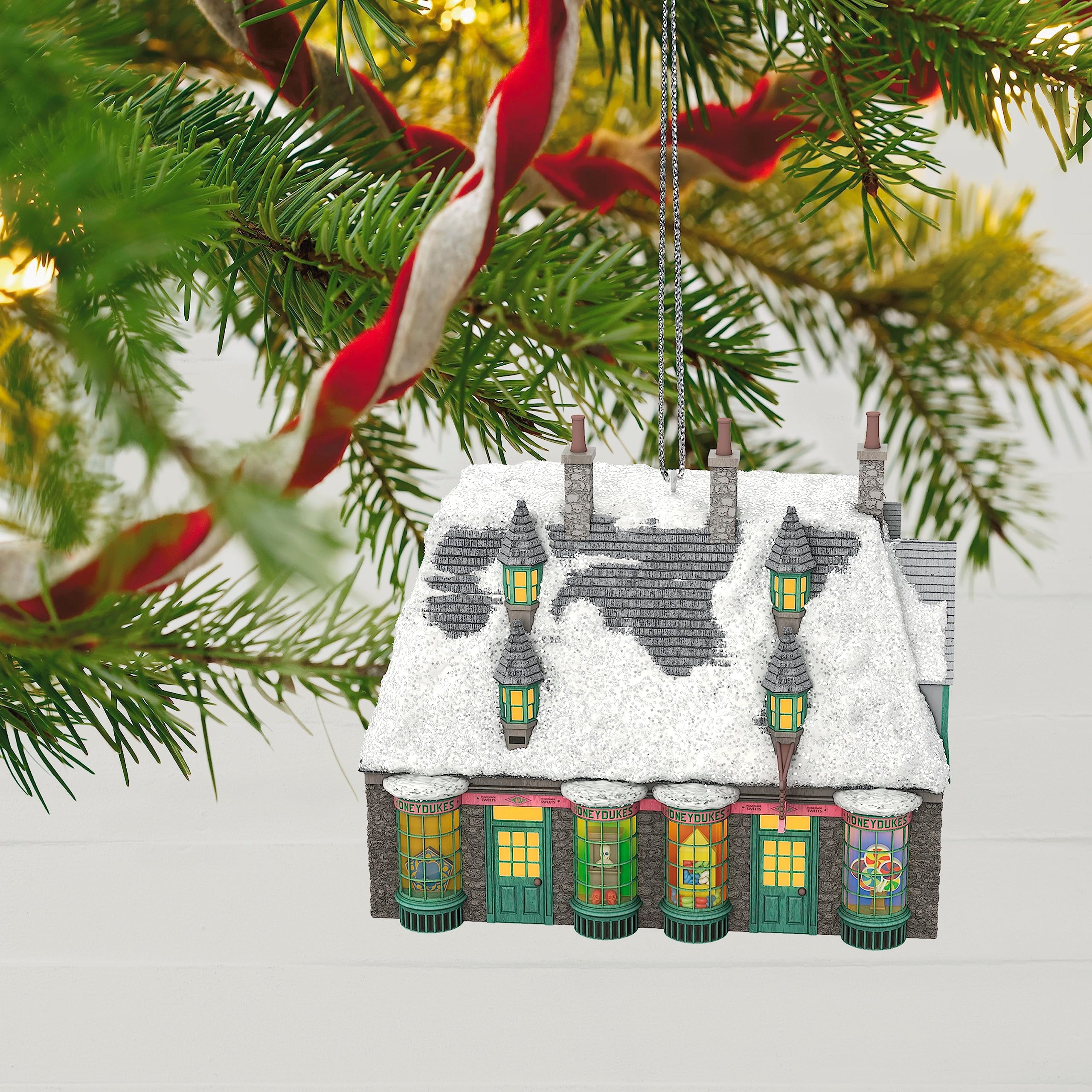 Hallmark Keepsake Honeydukes on a decorated tree showing holiday sparkle benefit