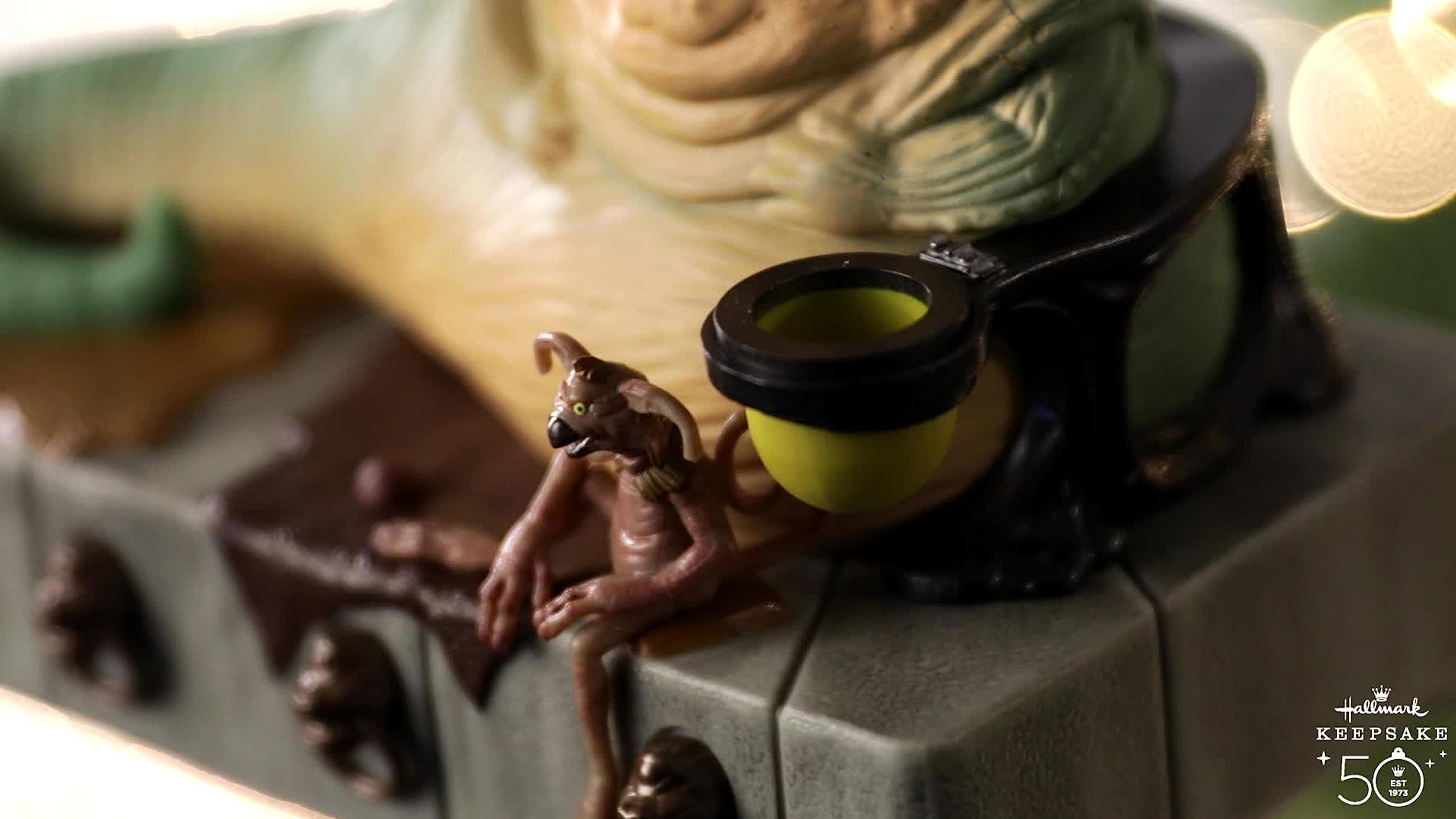 Hallmark Jabba ornament hung on Christmas tree adding fan-focused décor