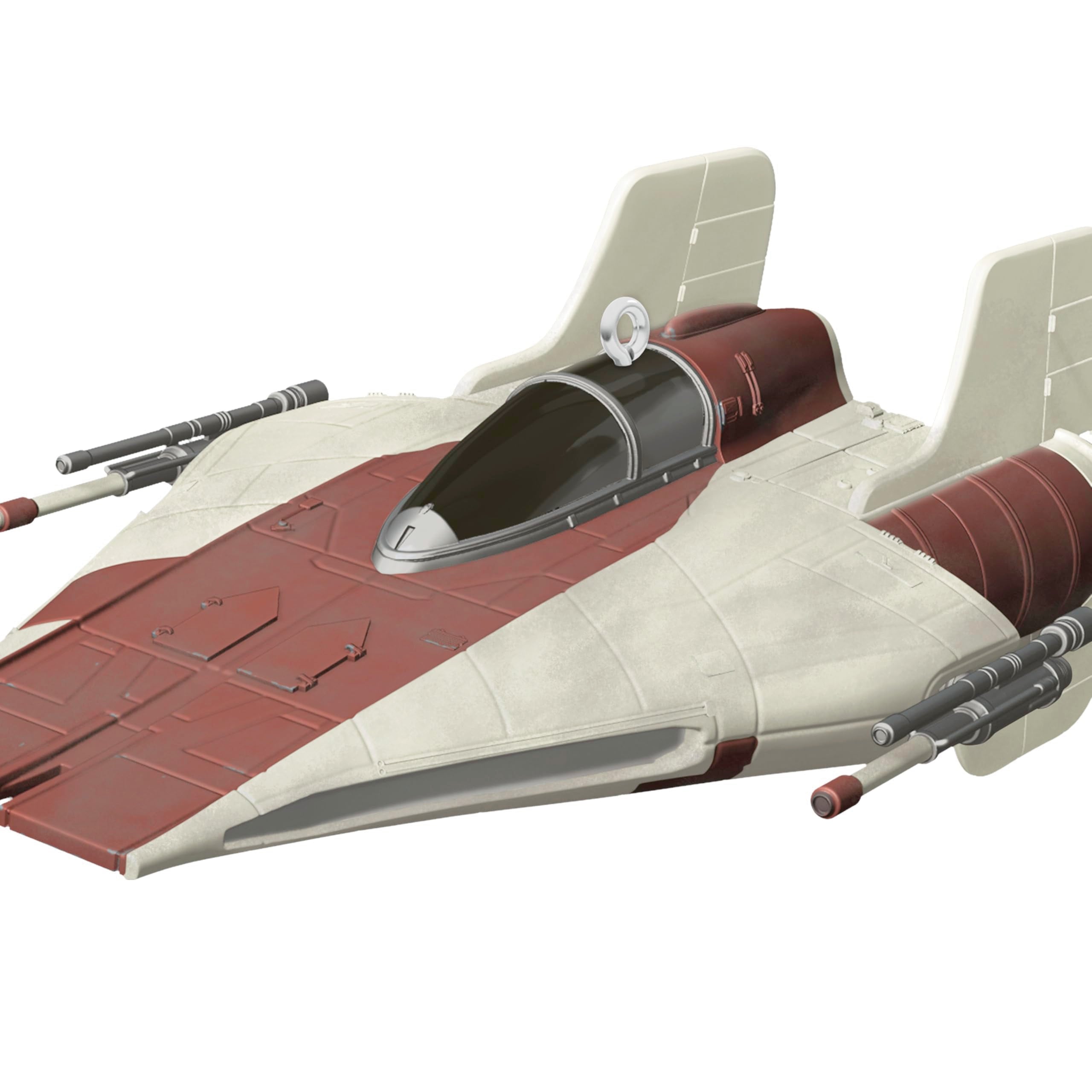 Hallmark Keepsake A-Wing beside ruler showing 2.75x1.75x4.5 inches for size clarity