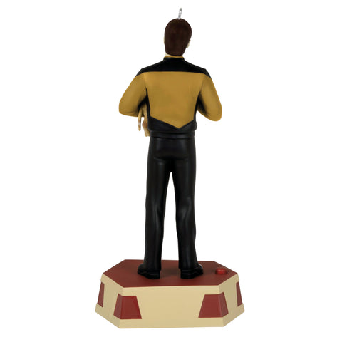 Hallmark Keepsake ornament next to coin for size reference and compact display benefit
