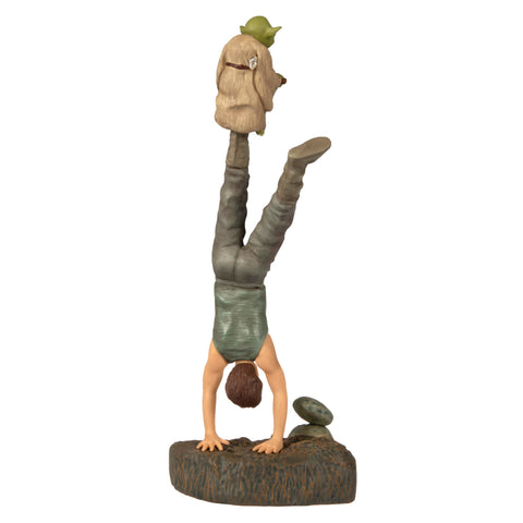 Hallmark Keepsake ornament held in hand to show scale and compact collectible size