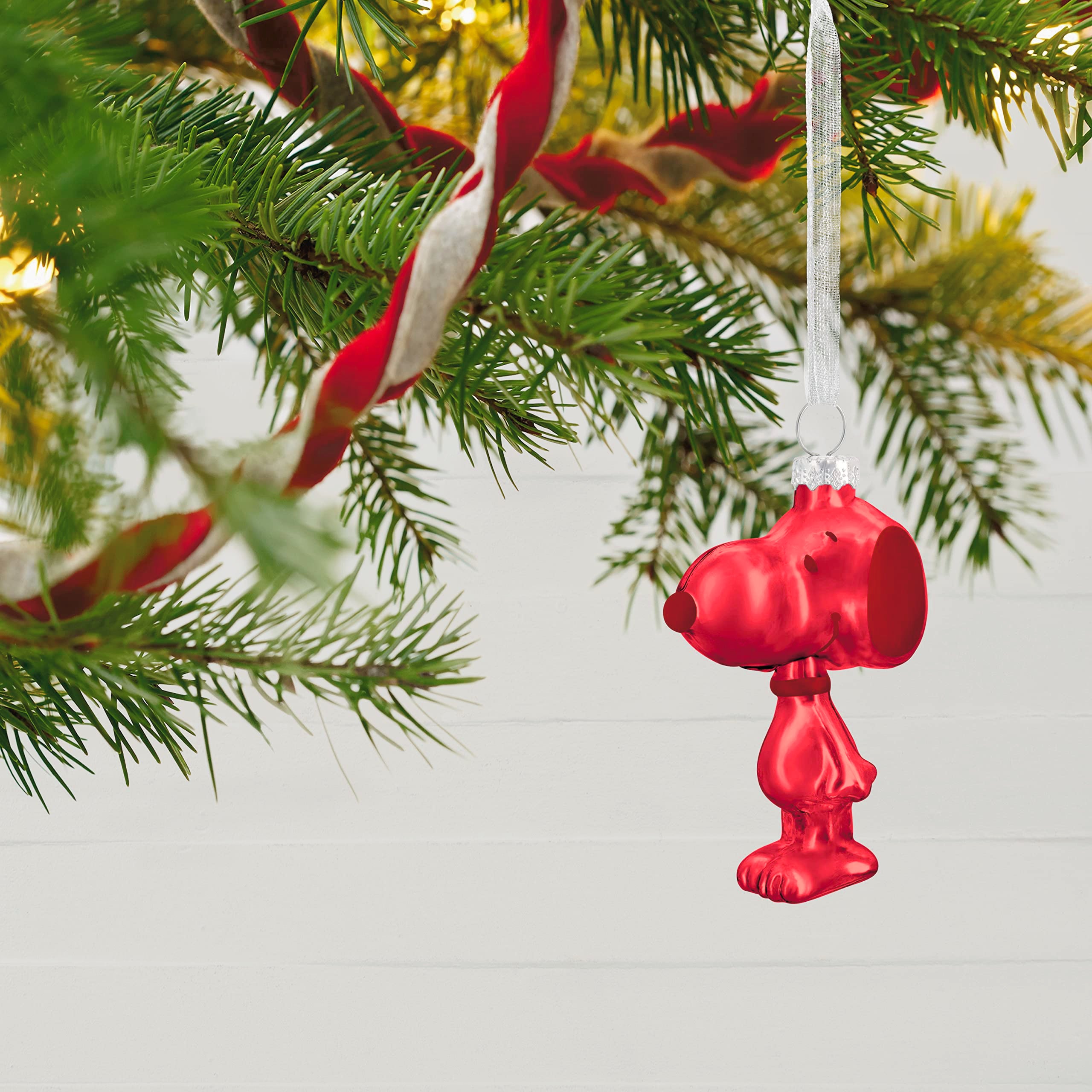 Hallmark Keepsake open gift box holding six Snoopy ornaments for safe storage and gifting